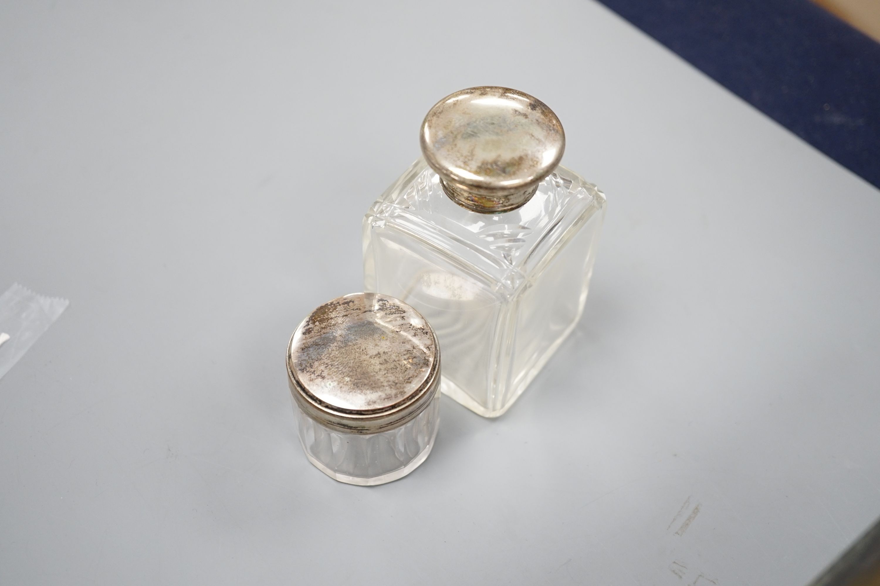 A Victorian brass mounted burr walnut toilet box, fitted with glass jars with electroplated tops, Width 30 cms. Ivory mounted items included